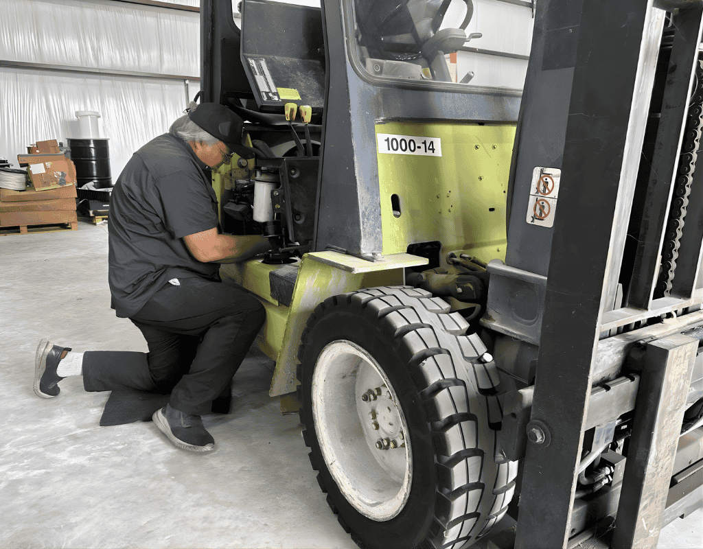 Forklift Rescue technician performing on-site forklift repair and maintenance service in Dallas Texas